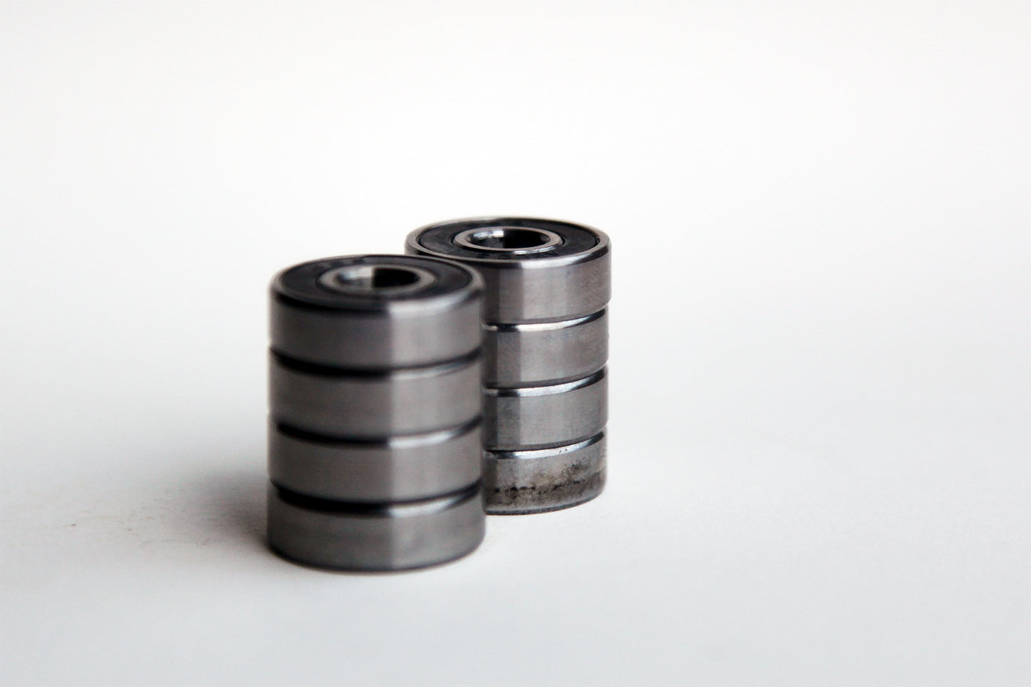 Two stacks of snakeboard wheel bearings