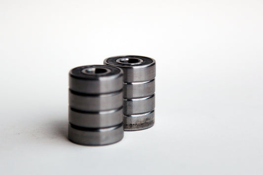 Two stacks of snakeboard wheel bearings